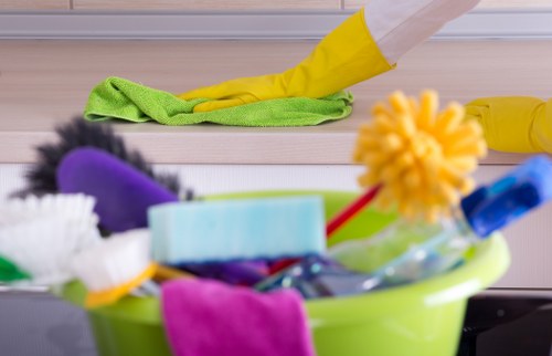 Professional oven cleaner in Surrey deep cleaning a kitchen oven