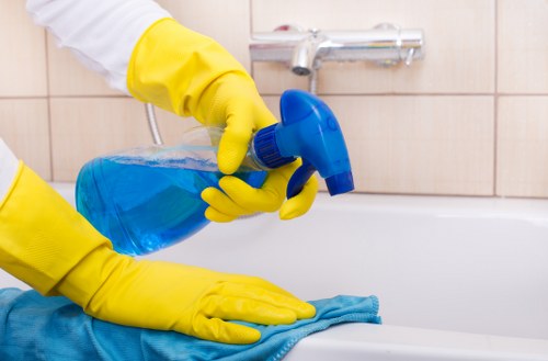 Carpet cleaning technician working safely in a Surrey property
