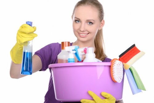 Operative using safe cleaning products and protective equipment